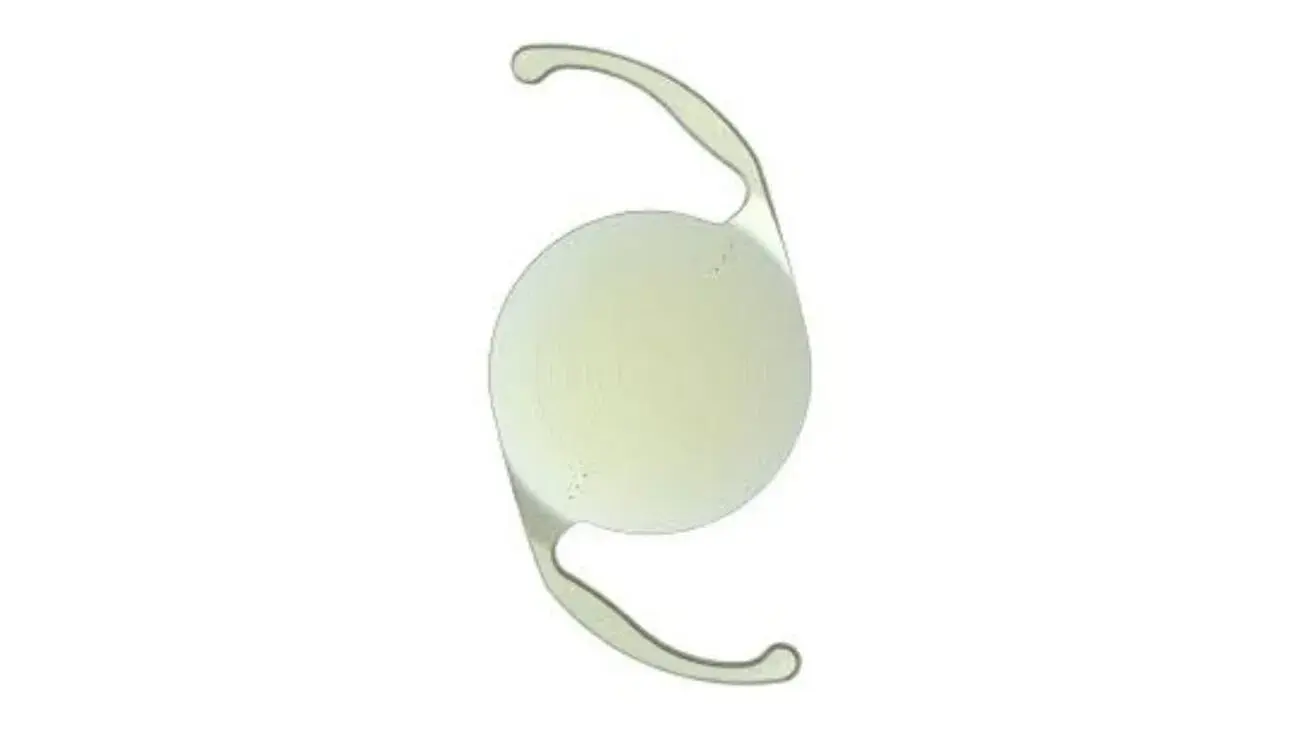 Top view of an Alcon IQ intraocular lens with clear round body and two support haptics.