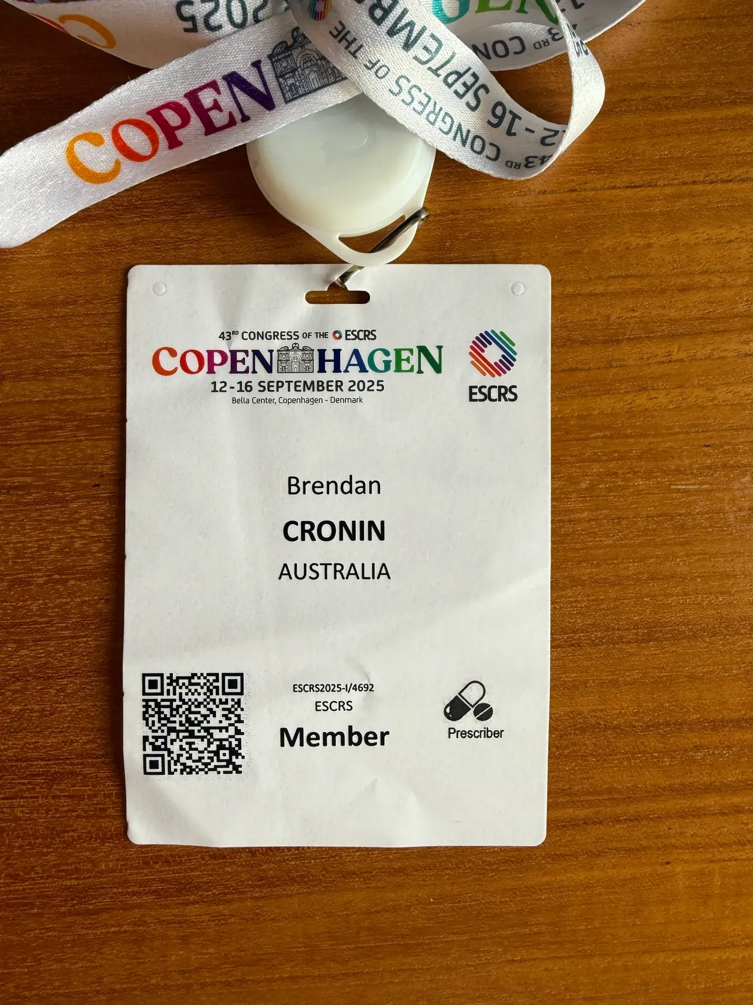 Conference badge for ESCRS in Copenhagen with attendee details.