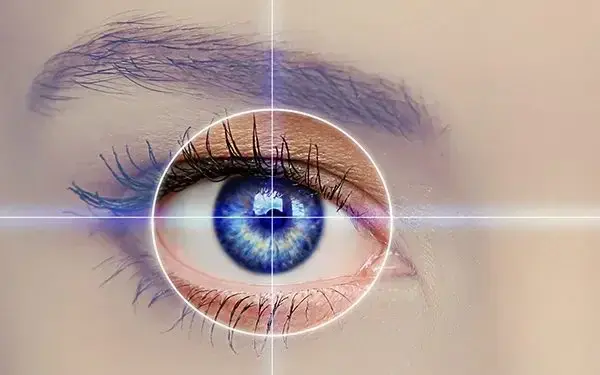 A close-up of a human eye with a digital crosshair and glowing effect overlay, suggesting advanced vision technology or eye examination by an expert ophthalmologist Brisbane.